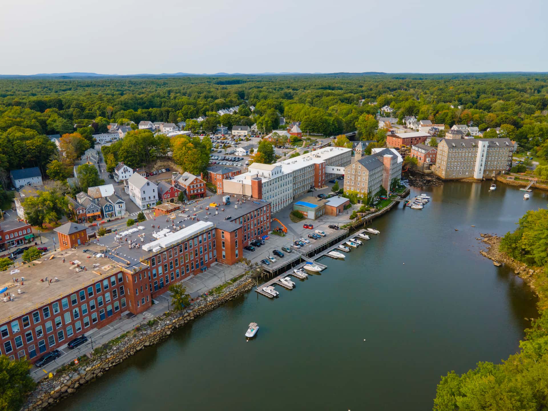 Newmarket Mills building aerial view on Lamprey River on Main Street in historic town center of Newmarket, New Hampshire